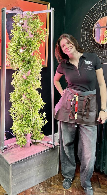A Harvestory growing tower on show at a drinks event